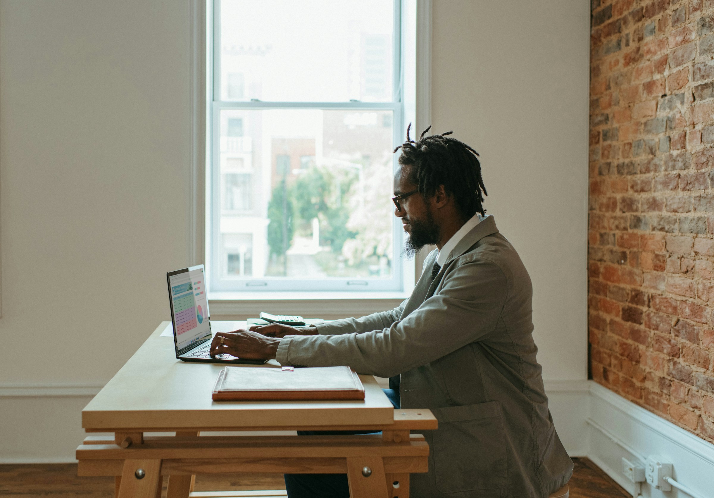 Professional working at a laptop in an office