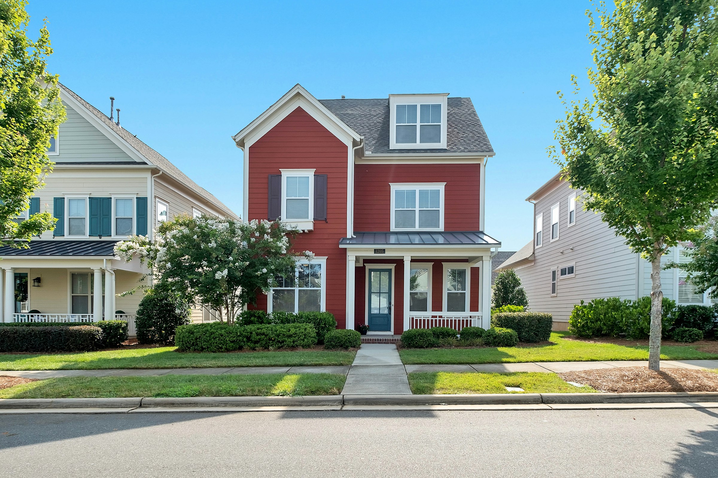 Suburban home exterior with a landscaped front yard